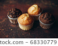 Beautiful vanilla and chocolate muffins with pieces of chocolate 68330779