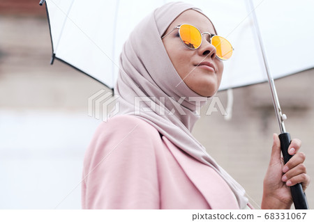 Muslim woman enjoying stroll Muslim woman enjoying stroll 68331067
