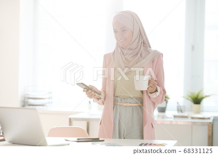 Successful Muslim businesswoman solving work issues Successful Muslim businesswoman solving work issues 68331125