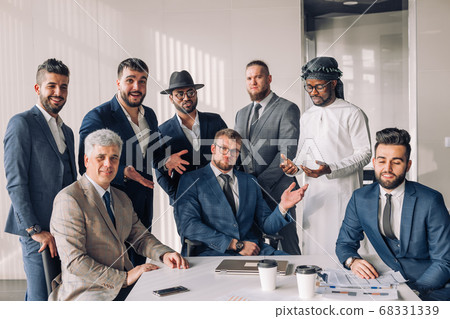 Multiracial group of business team consisting of men only with Executive indoor Multiracial group of business team consisting of men only with Executive indoor 68331339