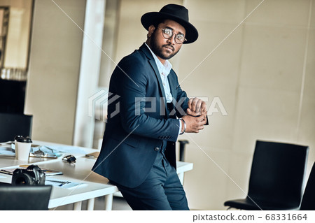 Image of handsome business man putting on watch. Image of handsome business man putting on watch. 68331664