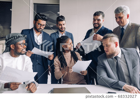 Female coach mentor talking with top managers in corporate training in office 68332027