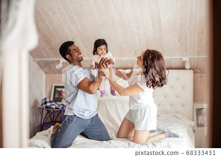 peasant gorgeous family having fun with a little kid peasant gorgeous family having fun with a little kid 68333431