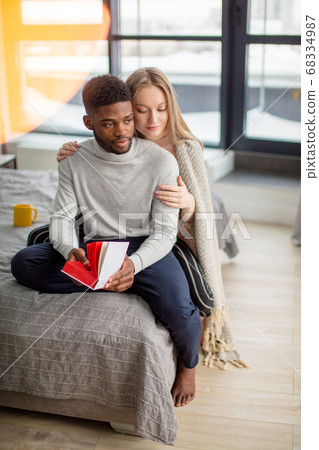 Happy interracial couple spending weekend... - Stock Photo [68334987] - PIXTA