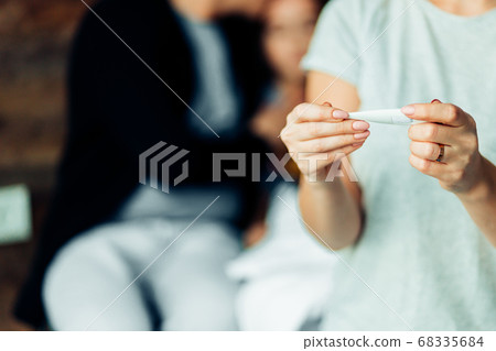 closeup of female holding thermometer 68335684