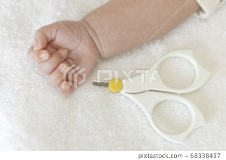 One month old baby hands and baby nail clippers One month old baby hands and baby nail clippers 68338457