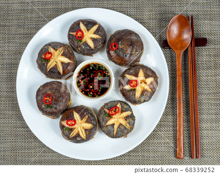 Korean: Shiitake mushroom pancake. Traditional Korean ritual food mainly eaten during holidays. Korean: Shiitake mushroom pancake. Traditional Korean ritual food mainly eaten during holidays. 68339252