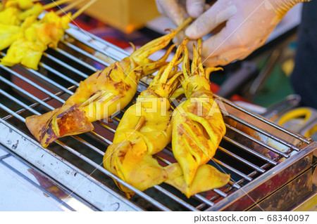 Grilled Squid in street food market thailand Grilled Squid in street food market thailand 68340097