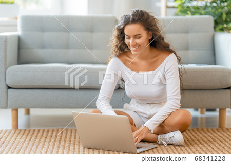 woman working on laptop at home. 68341228