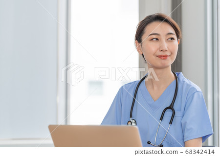 Female medical practitioner, female doctor Female medical practitioner, female doctor 68342414
