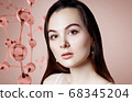 Beautiful young woman near big glass molecule structure. 68345204