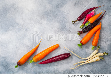 Carrots, parsnip and radish on grey washed 68345407