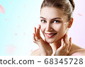 Young beautiful woman over with swirl petals. 68345728