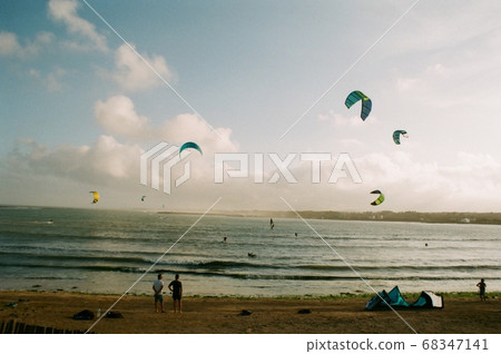 People enjoying kite surfing at Sinyang-ri Beach, Jeju Island People enjoying kite surfing at Sinyang-ri Beach, Jeju Island 68347141