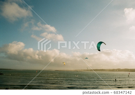 People enjoying kite surfing at Sinyang-ri Beach, Jeju Island People enjoying kite surfing at Sinyang-ri Beach, Jeju Island 68347142