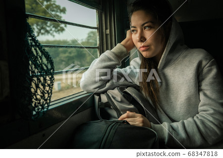 Young female passenger travel by passenger Train Young female passenger travel by passenger Train 68347818