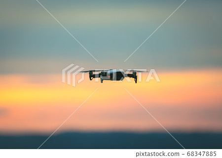 Drone pilotage on the sky at sunset. Drone pilotage on the sky at sunset. 68347885