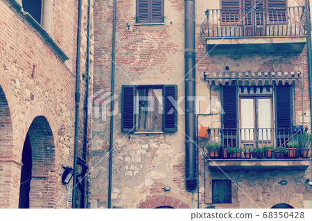 detail of old facades in Tuscany 68350428