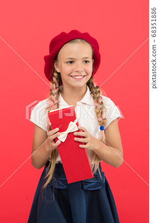 Kid little girl in school uniform and beret hold 68351886