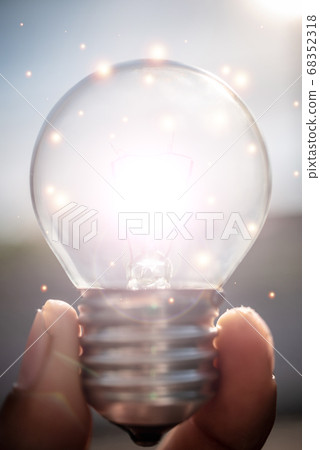 Close-Up Of Illuminated Light Bulb 68352318
