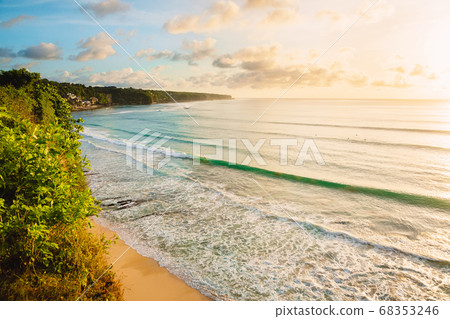 Coastline with beach, waves for surfing and warn sunlight in Bali Coastline with beach, waves for surfing and warn sunlight in Bali 68353246