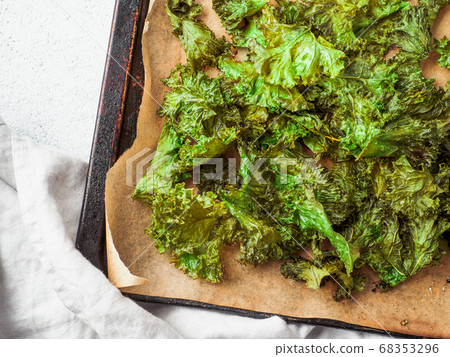 Kale Chips with salt on oven-tray, copy space 68353296