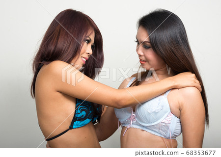 Portrait of two young Asian women wearing - Stock Photo [68353677] -  PIXTA