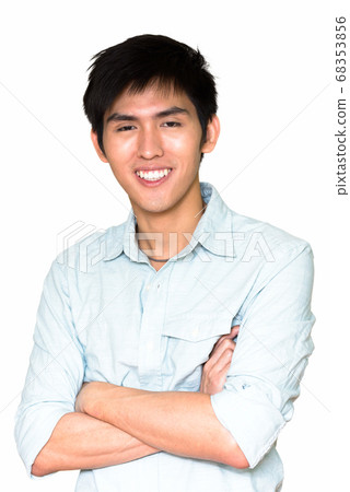 Studio shot of young happy Asian man smiling isolated against white background Studio shot of young happy Asian man smiling isolated against white background 68353856