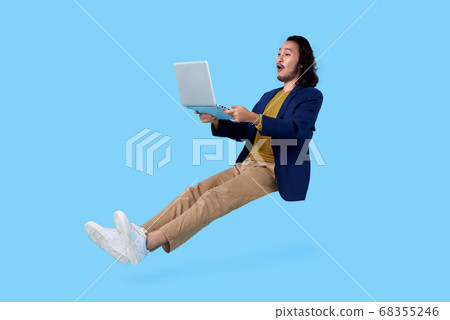 man holding computer laptop floating in mid-air 68355246