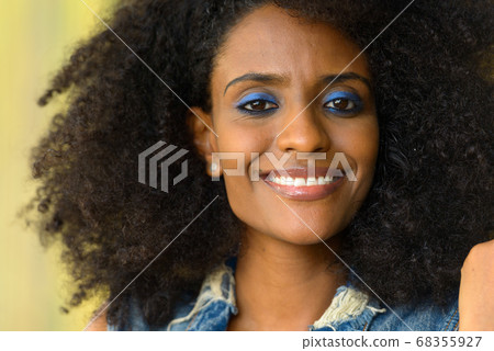 Happy young beautiful African woman with Afro hair outdoors 68355927