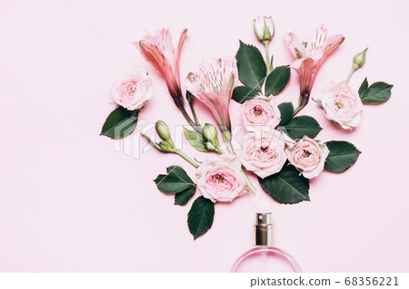 Floral arrangement with perfume bottle and pink Floral arrangement with perfume bottle and pink 68356221