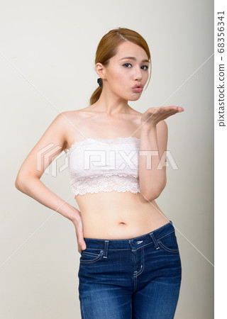 Portrait of young beautiful Asian woman in underwear as health concept Portrait of young beautiful Asian woman in underwear as health concept 68356341