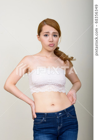 Portrait of young beautiful Asian woman in underwear as health concept Portrait of young beautiful Asian woman in underwear as health concept 68356349