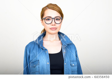Portrait of young beautiful Asian woman with eyeglasses 68356450
