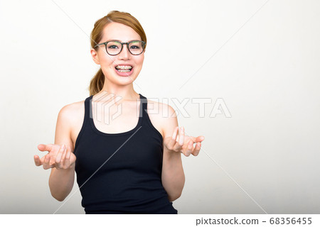 Portrait of happy young beautiful Asian woman Portrait of happy young beautiful Asian woman 68356455