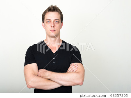 Portrait of handsome man against white background Portrait of handsome man against white background 68357205