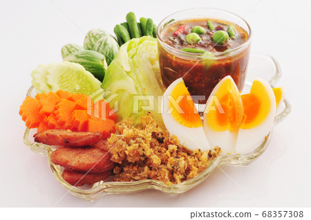 Spicy Chili Paste Nam Prik with crispy catfish, boiled eggs and vegetables, thai cuisine Spicy Chili Paste Nam Prik with crispy catfish, boiled eggs and vegetables, thai cuisine 68357308