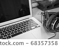 Telework laptop and headphones 68357358