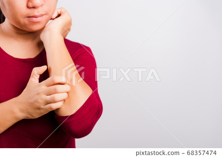 Asian beautiful woman itching her scratching her Asian beautiful woman itching her scratching her 68357474