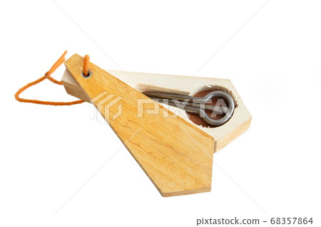 The Jew's harp. Musical instrument of the peoples of the North and Asia. Lip instrument of the peoples of the North and Asia. Isolated The Jew's harp. Musical instrument of the peoples of the North and Asia. Lip instrument of the peoples of the North and Asia. Isolated 68357864