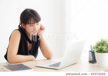 Beautiful freelance young asian woman thinking and idea working laptop computer at office. Beautiful freelance young asian woman thinking and idea working laptop computer at office. 68359268