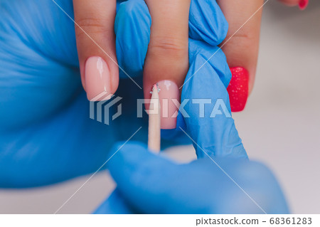 woman doing manicure in a beauty salon. Close-up of hands. woman doing manicure in a beauty salon. Close-up of hands. 68361283