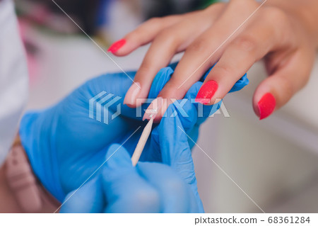woman doing manicure in a beauty salon. Close-up of hands. woman doing manicure in a beauty salon. Close-up of hands. 68361284