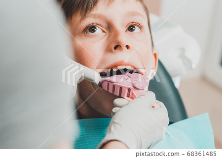 Registration of impressions and bites in a young teenager. Functional modern dental diagnostics. Registration of impressions and bites in a young teenager. Functional modern dental diagnostics. 68361485