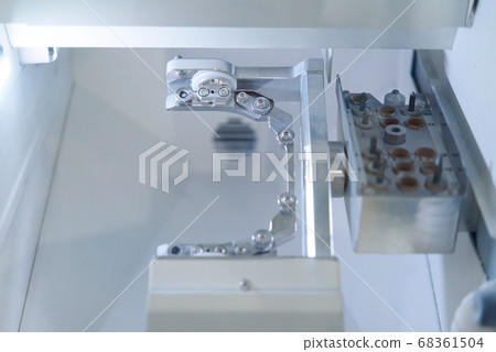 Dental milling computer-aided machine in a highly modern dental laboratory for teeth prosthesis and crowns milling. Dental milling computer-aided machine in a highly modern dental laboratory for teeth prosthesis and crowns milling. 68361504