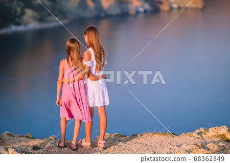 Children outdoor on edge of cliff seashore Children outdoor on edge of cliff seashore 68362849