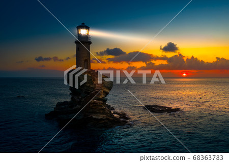 The beautiful Lighthouse Tourlitis of Chora at night. Andros island, Cyclades, Greece 68363783