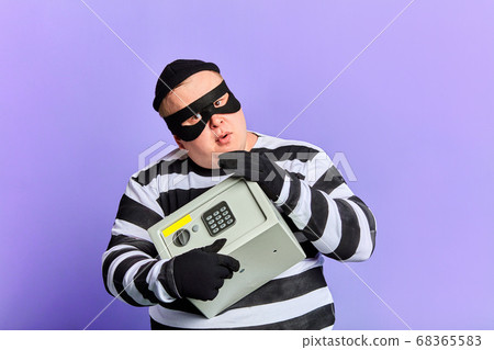 serious fat prisoner hugging safe 68365583