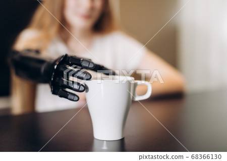 girl with artificial arm working so effectively girl with artificial arm working so effectively 68366130