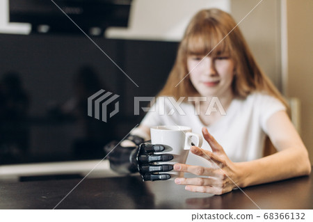 awesome girl managing with her prosthetic arm awesome girl managing with her prosthetic arm 68366132